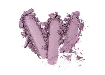 Smear of purple eyeshadow isolated on white