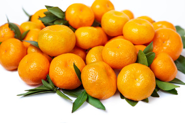 Bright tangerines on a white isolated background.