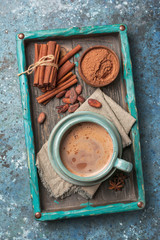 Tasty cocoa drink with spices in big cozy cup
