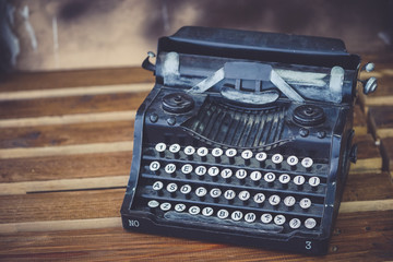 Vintage type writer. An old type writer with vintage filter and soft focus on the  alphabet keys.