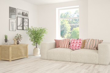 Stylish room in white color with sofa and summer landscape in window. Scandinavian interior design. 3D illustration