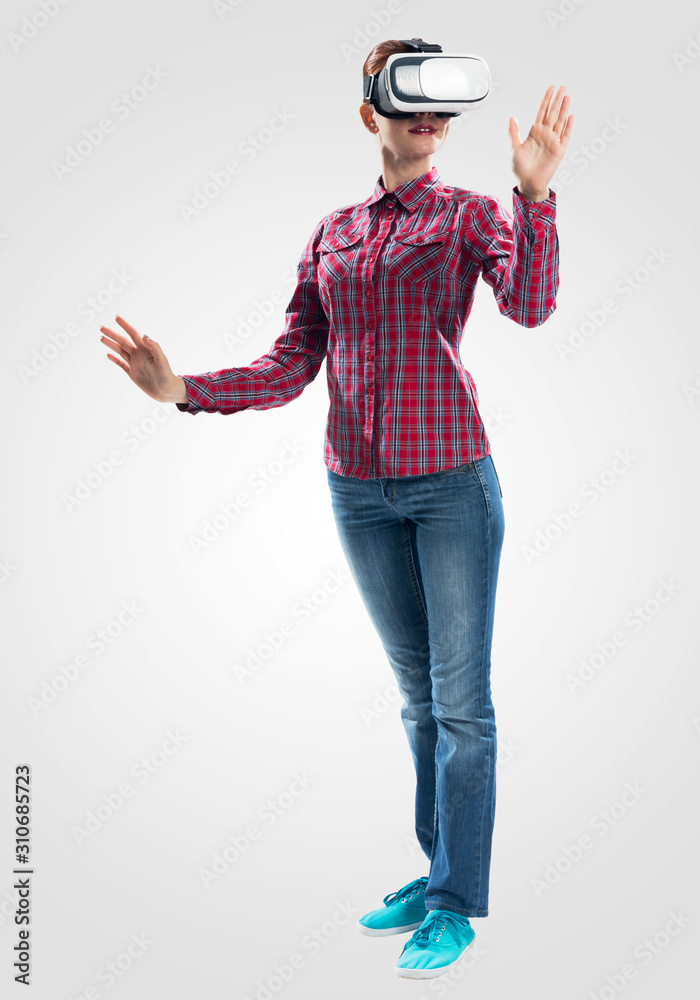 Poster Young woman wearing VR goggles and gesturing