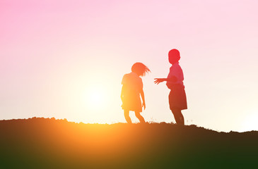 Fototapeta premium kid silhouette,Moments of the child's joy. On the Nature sunset