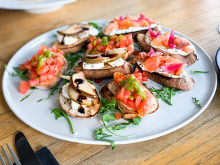 variety plate of bruschetta with fresh ingredients
