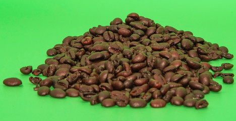 coffee beans on green background
