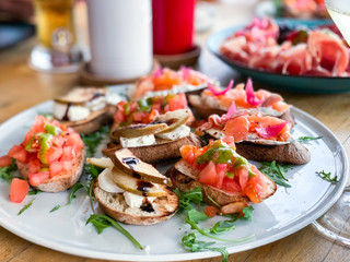 variety plate of bruschetta with fresh ingredients