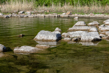 Fototapeta na wymiar stones in lake water
