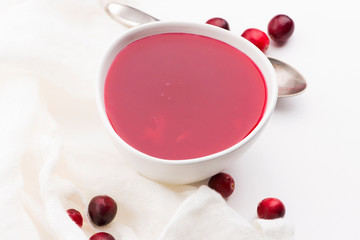 Obraz na płótnie Canvas Bowl of Jelly with Cranberry on a white background