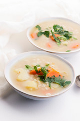 Barley soup, pearl barley in white bowl