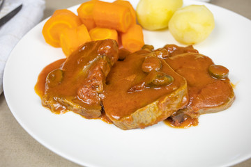 beef tongue tomato sauce and vegetables
