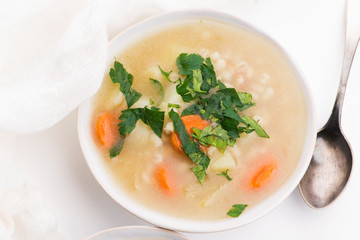 Barley soup, pearl barley in white bowl