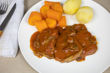 beef tongue tomato sauce and vegetables