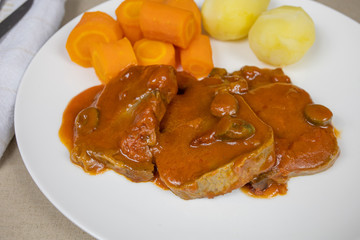 beef tongue tomato sauce and vegetables