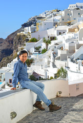 Fototapeta na wymiar Young man enjoying in Santorini, Greece.