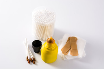 Medical iodine in a bottle and gauzes on white background.	