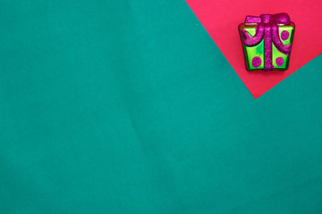 Present box on red and green background with copy space for new year and christmas time