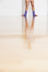 Fototapeta na wymiar Low Section Of Ballerina In Rehearsal Room
