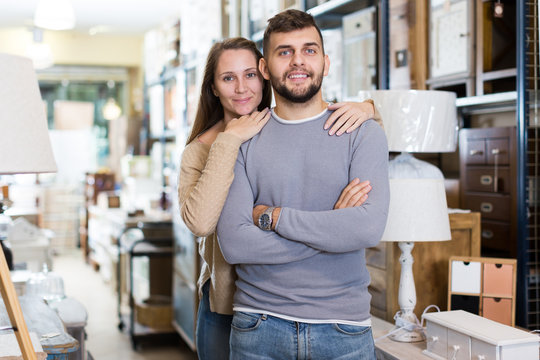 Couple in antique furnishings store