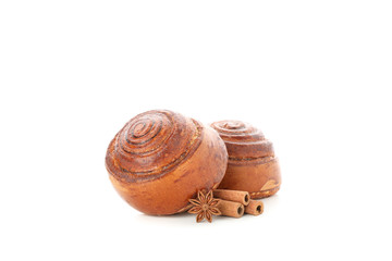 Freshly baked cinnamon roll with ingredients isolated on white background