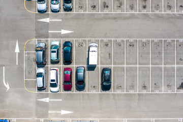 Empty parking lots, aerial view. A lot of cars in the parking lot. Colorful moody drone shoot.