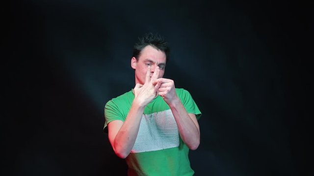 A married man takes off a wedding ring from his finger.