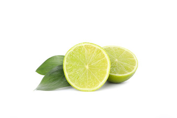 Limes with leaves isolated on white background. Juicy fruits