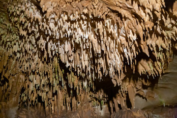 Stalactites, stalagmites and streak formations in cave of Balzarca. Moravian Karst. Czech Republic