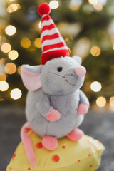 Little mouse toy, symbol of 2020. new year decoration. New Year 2020 Symbol. Greeting Christmas card.  Selective focus.