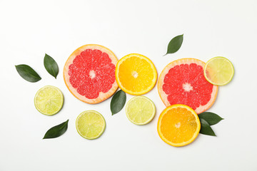 Flat lay with exotic fruits on white background, space for text