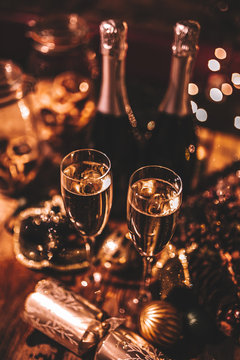 New Year&rsquo;s Eve celebration with bottles and glasses of champagne. Masquerade themed party. Concept of celebration and luxury lifestyle.