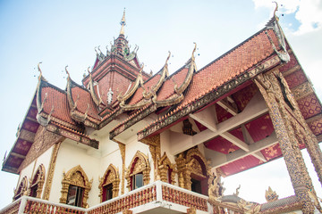 View to the upper floor of Wat Buppharam temple and the detailed traditional Thai style roof. In Chiang Mai, Thailand