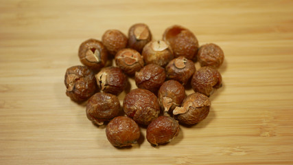 Soap nuts Indian soapberry or washnut, Sapindus mukorossi reetha or ritha from the soap tree shells are used to wash clothes to put in drum washing machines. Nuts contain saponin plant fruit seeds