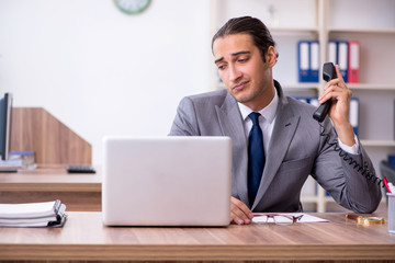 Fototapeta premium Unhappy male businessman in the office