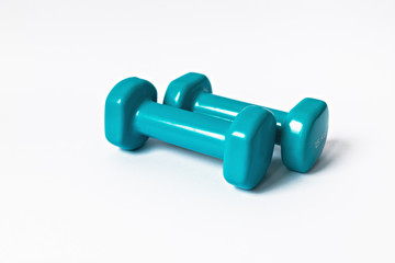 Blue dumbbells for fitness on a white background. Healthy lifestyle.