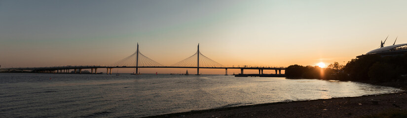 Fototapeta na wymiar Panorama of the bridge at sunset