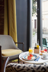 Intimate caffe English breakfast served with coffe and juice
