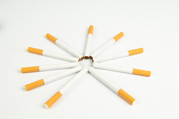 Close up of group of unlit cigarettes isolated on a white background