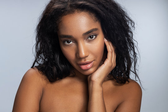 Beautiful young Afro-American woman posing in studio