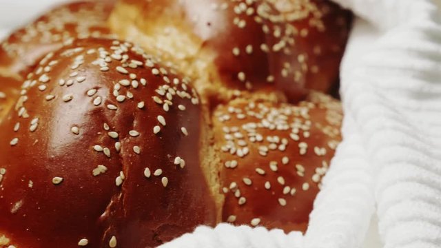 Traditional Jewish Braided Challah Bread for Shabbat. Ears of Wheat. Dolly Shot. Slow Motion. 4K.