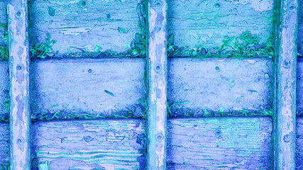 background with a fragment of an old wooden surface with peeling paint.
