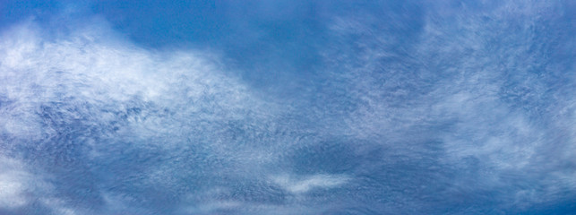 Large panorama of odd and strange cloud textures in the middle of the day in front of blue sky forming above Zagreb, Croatia