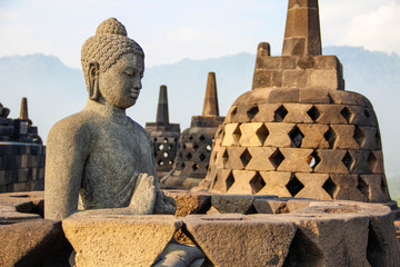 A figure of a winged face of the bells in The Borobudur Temple. Indonesia