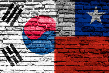 Flag of South Korea and Chile on brick wall