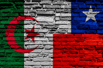 Flag of Algeria and Chile on brick wall