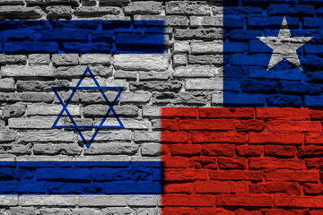 Flag of Israel and Chile on brick wall