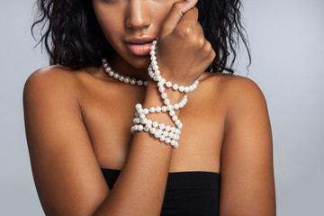 Afro American girl posing for camera in studio