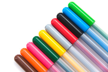 Opened colorful markers lying in a diagonal row on a white background. Isolated. Art and education. Selective focus.