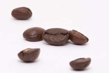 Close up of coffee beans on a white background