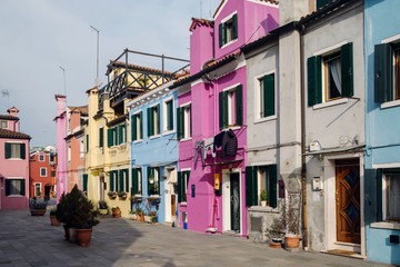 Fototapeta na wymiar Traditional Italian houses with wooden shutters