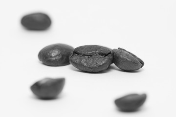 Close up of coffee beans on a white background